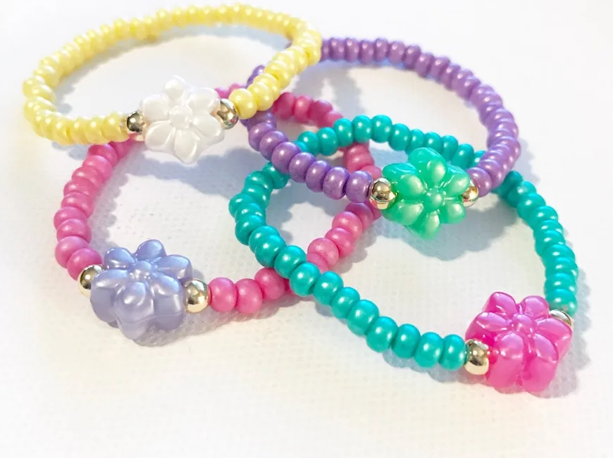 Bright pastel bead bracelets with flower charms for spring
